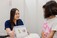 A Speech Pathologist from SASHC conducting a speech therapy session with a young child, using visual